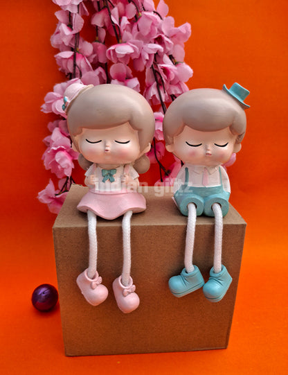 Cute Boy & Girl Hanging Legs Dolls – Polyresin Decorative Showpiece suitable for Tabletop Decoration Gifting, Home Decor, Table, Office Table