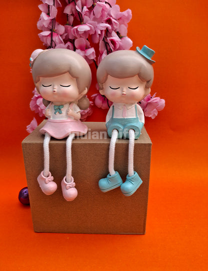 Cute Boy & Girl Hanging Legs Dolls – Polyresin Decorative Showpiece suitable for Tabletop Decoration Gifting, Home Decor, Table, Office Table