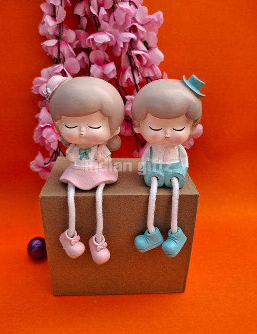 Cute Boy & Girl Hanging Legs Dolls – Polyresin Decorative Showpiece suitable for Tabletop Decoration Gifting, Home Decor, Table, Office Table